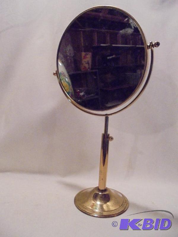 lot 102 image: 12 inch brass pedestal mirror. ...
