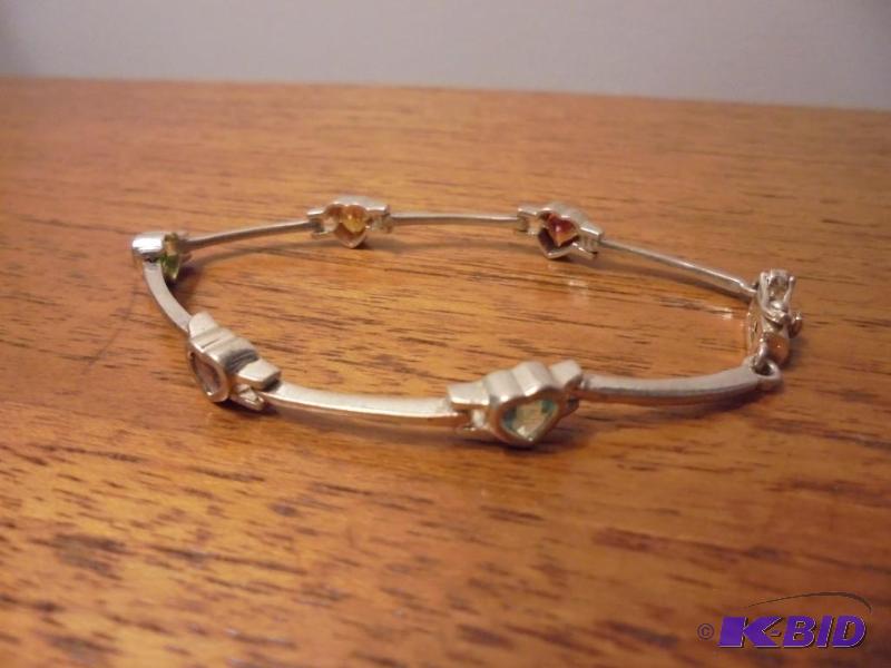 lot 13 image: Sterling Silver heart bracelet with multi col...