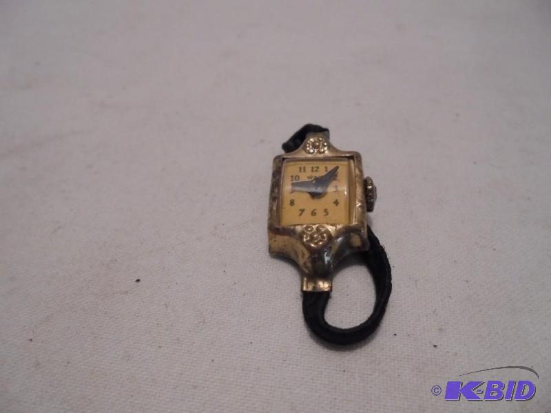 lot 54 image: W & W vintage finger watch.  ...