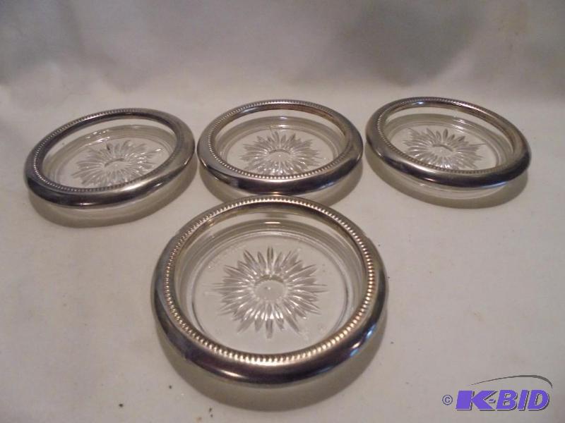 lot 64 image: Lot of (5) silver plate glass coasters.  ...