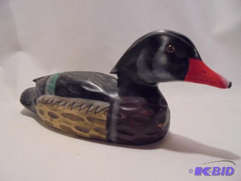 lot 98 image: Hand painted and wooden duck decoy.  ...