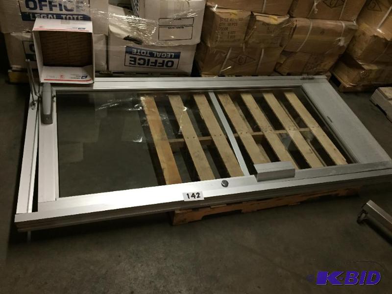 lot 142 image: Aluminum and glass commercial door with frame...