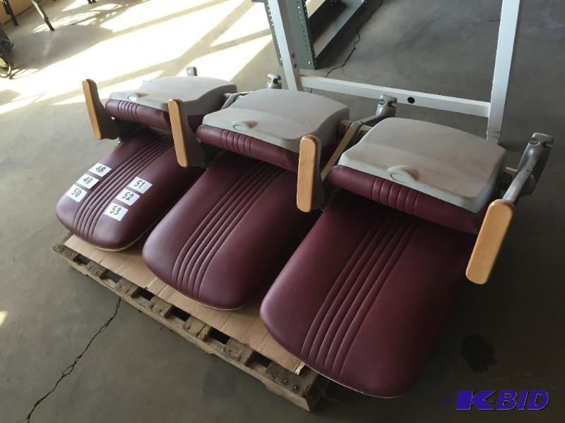lot 48 image: Bank of 3 maroon stadium seats with U of M lo...