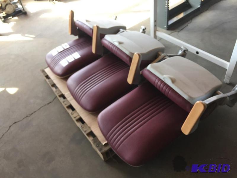 lot 51 image: Bank of 3 maroon stadium seats with U of M lo...