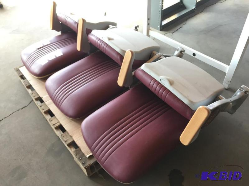 lot 53 image: Bank of 3 maroon stadium seats with U of M lo...