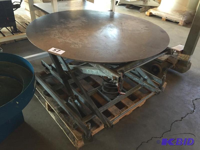 lot 57 image: Spring loaded pallet wrapping table....
