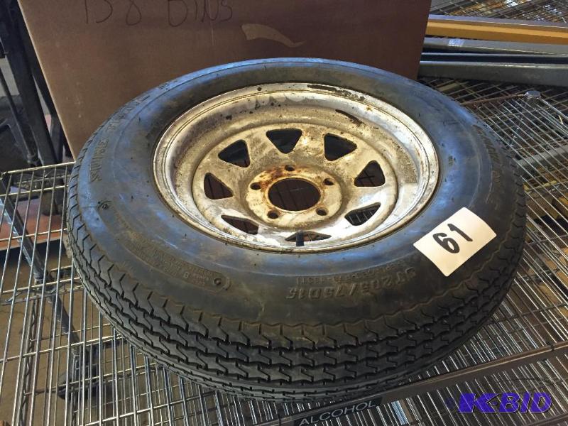 lot 61 image: Trailer spare tire and wheel....