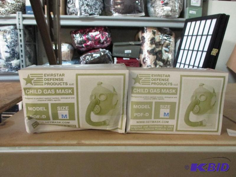 2 New Childs gas masks, size M...