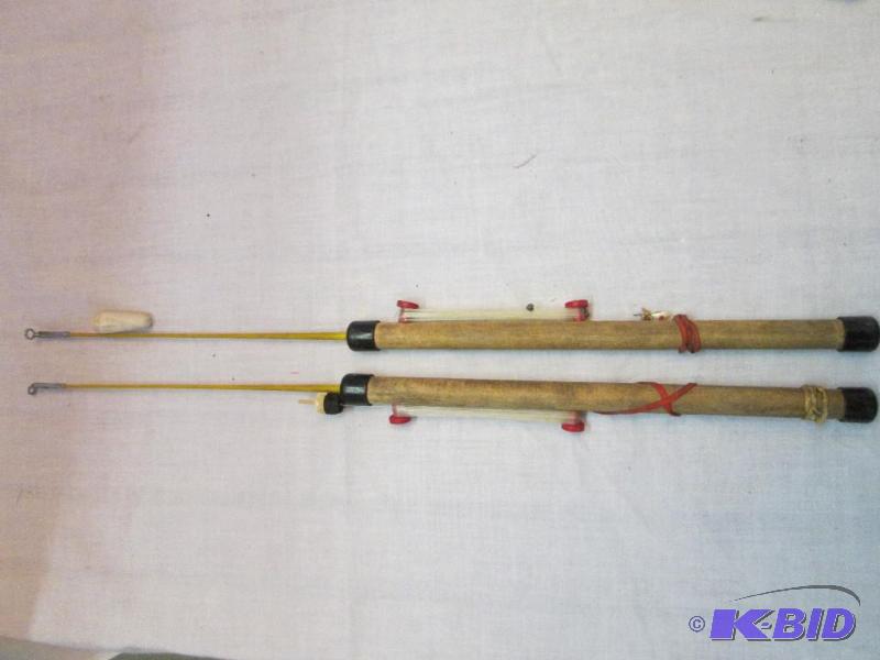 lot of matching vintage fighing poles...