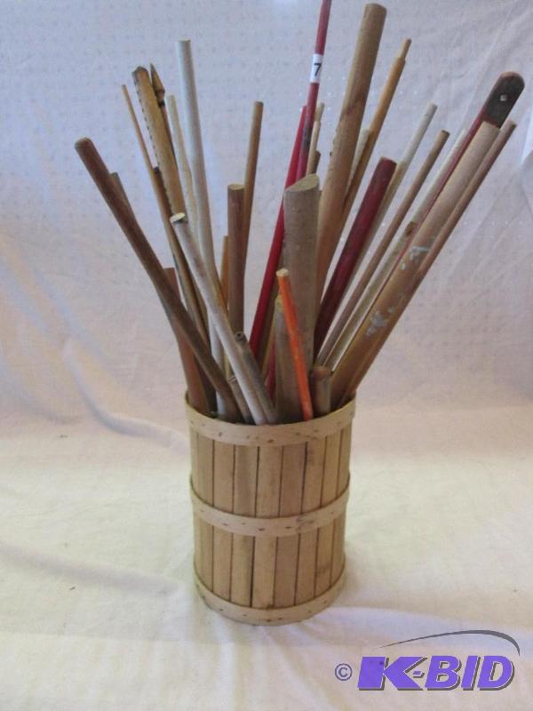 wooden container with assorted wood sticks an...