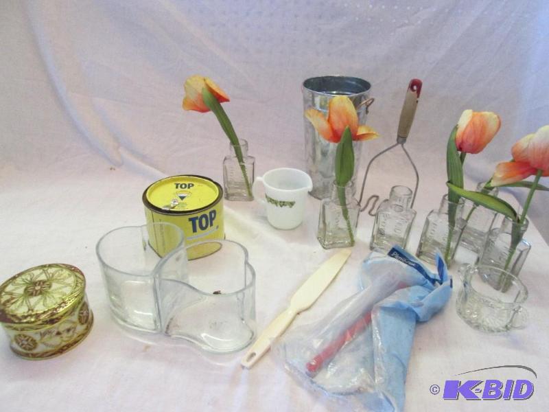 mixed lot of glass bottles, tins, orange flow...