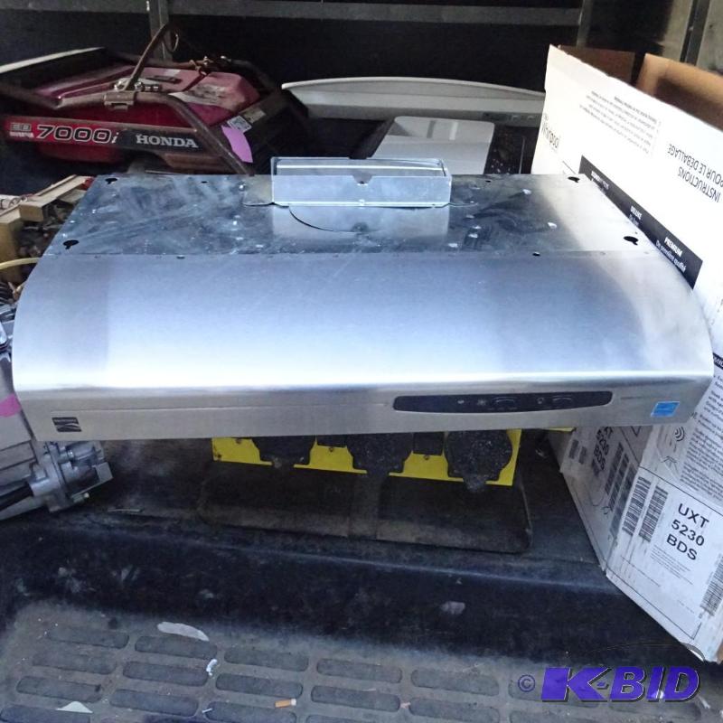 lot 21 image: Kenmore stainless over the range hood...
