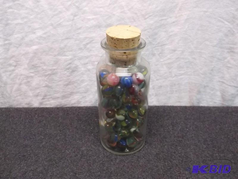 Large jar loaded with marbles....
