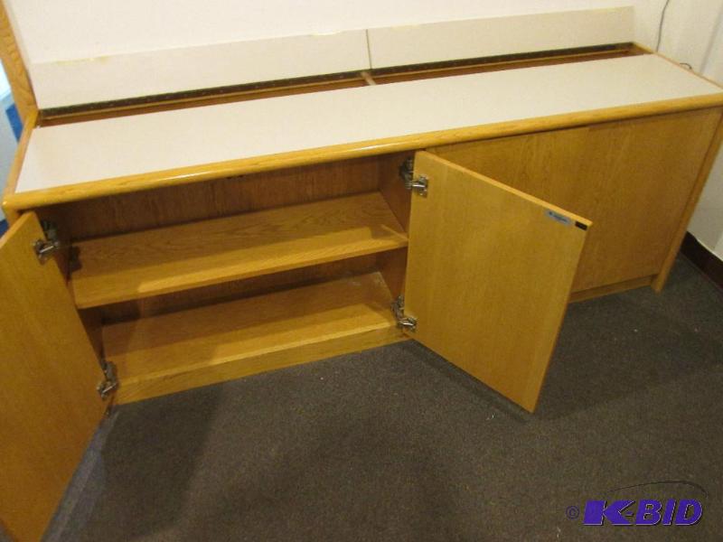 lot 18 image: Very nice solid wood cabinet with formica top...