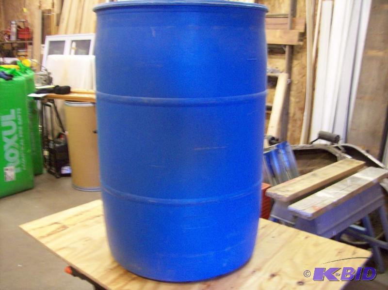 55 gallon blue plastic storage barrell, with ...