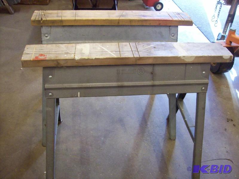 Two metal folding saw horses with 2x6 on top ...