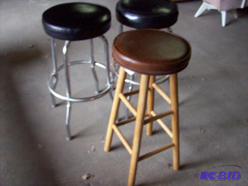Three stools, two matching black with chrome ...