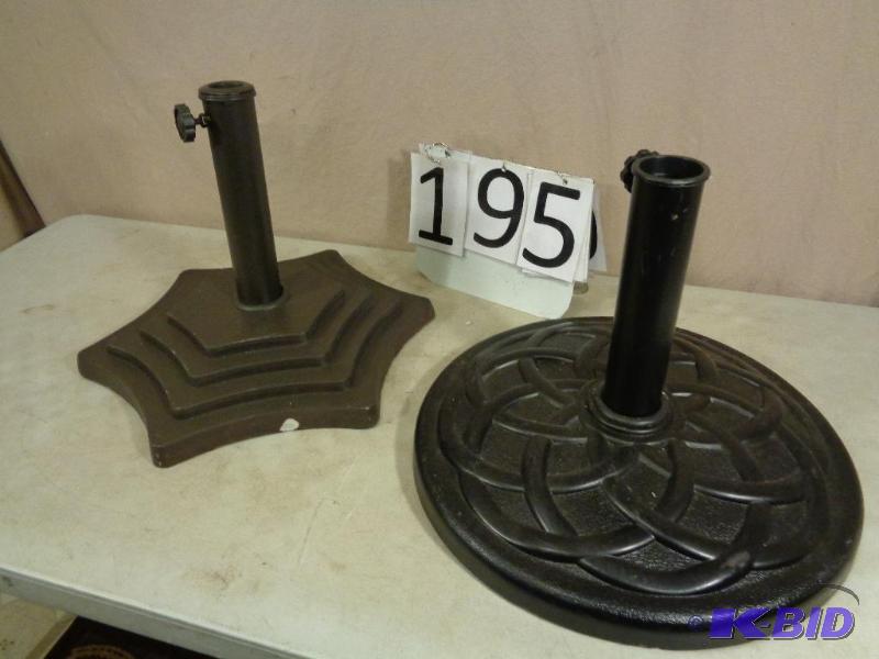 2 New Display Model Umbrella Bases. One has a...