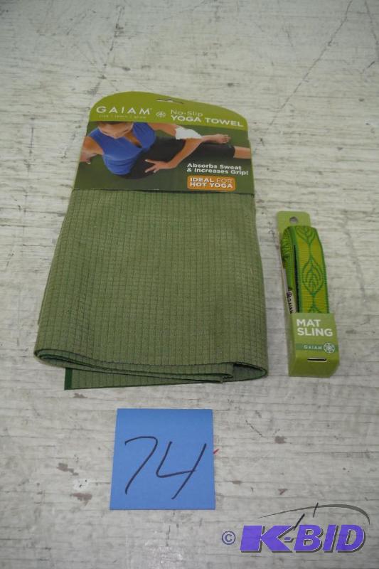 lot 74 image: Gaiam Dual-Grip Thirsty Yoga Mat Towel, and a Gaiam Flower Power Yoga Mat Sling (Spring Grass)