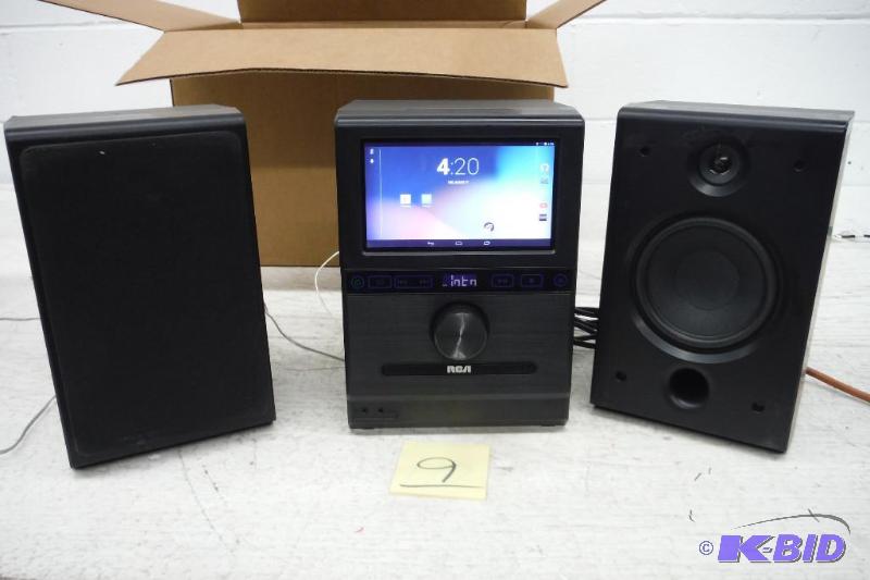 lot 9 image: RCA Home Stereo System w Removable 7-inch Android Tablet and Two 20 Watt Bluetooth Speakers