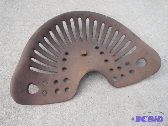 lot 15 image: Cast iron tractor seat...