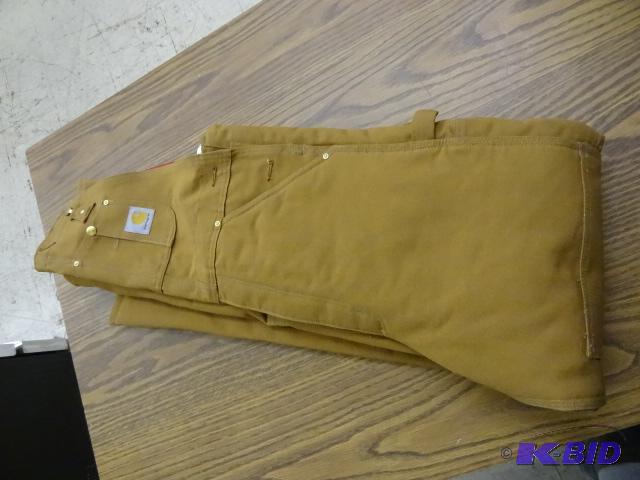 lot 17 image: Carhartt insulated coveralls. 32 x 36...