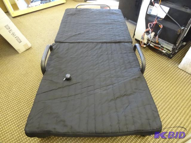 lot 71 image: Fold away bed for unexpected guests. One whee...