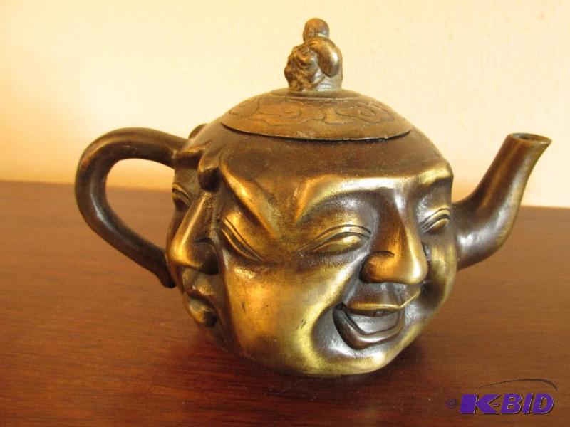 lot 11 image: Vintage Asian Tea Pot with Four Faces