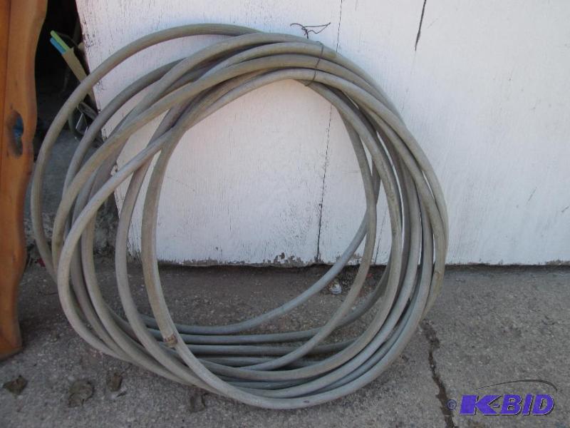 lot 105 image: Long garden hose...