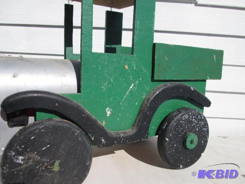 lot 149 image: Green wood cutout of a tractor mailbox holder...