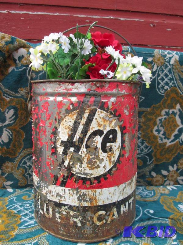 lot 4 image: Vintage Ace Lubricant can with silk flowers...