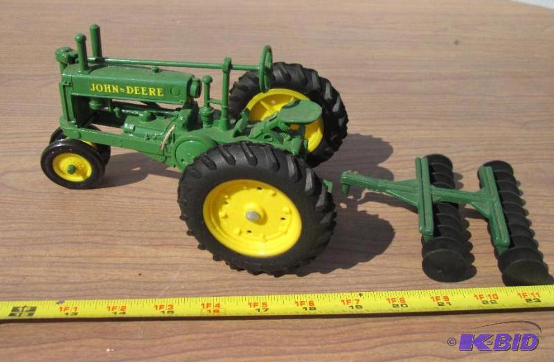 lot 64 image: John Deere tractor and disc...