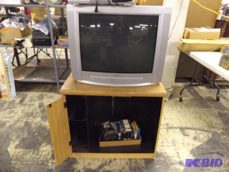 TV and Cabinet, with VCR tapes...