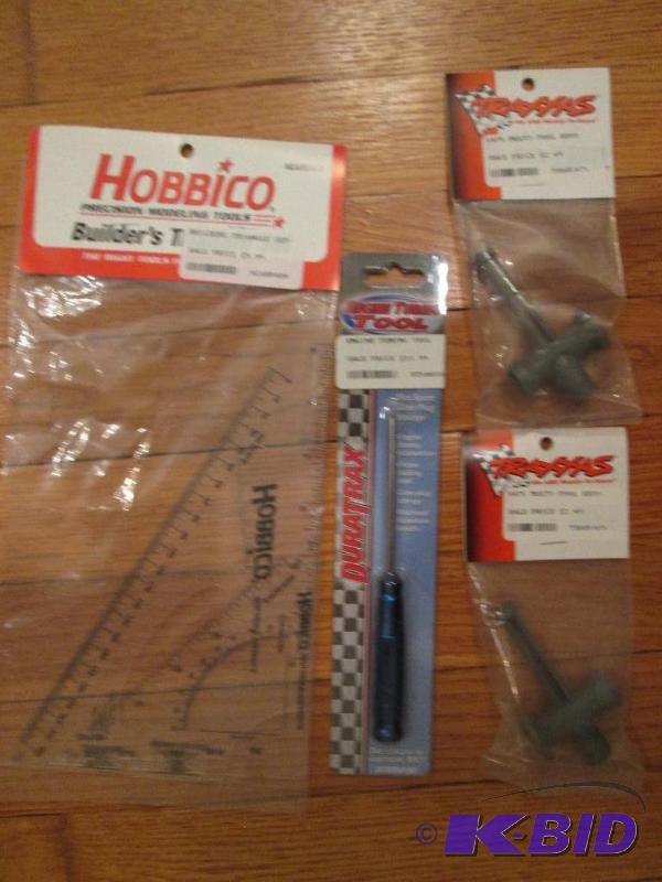 lot 96 image: Square, multi tool, and an engine tuning tool...