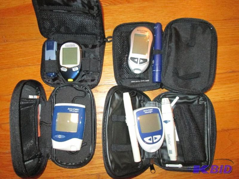 Lot of assorted Accucheck and other monitors ...