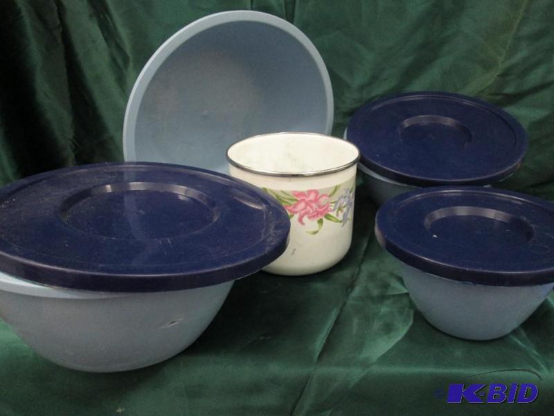 four plastic bowls - three have lids. Used. W...