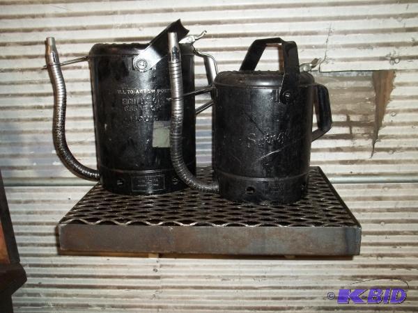 lot 29 image: Two oil cans with drain catch, 8qt and 5qt....