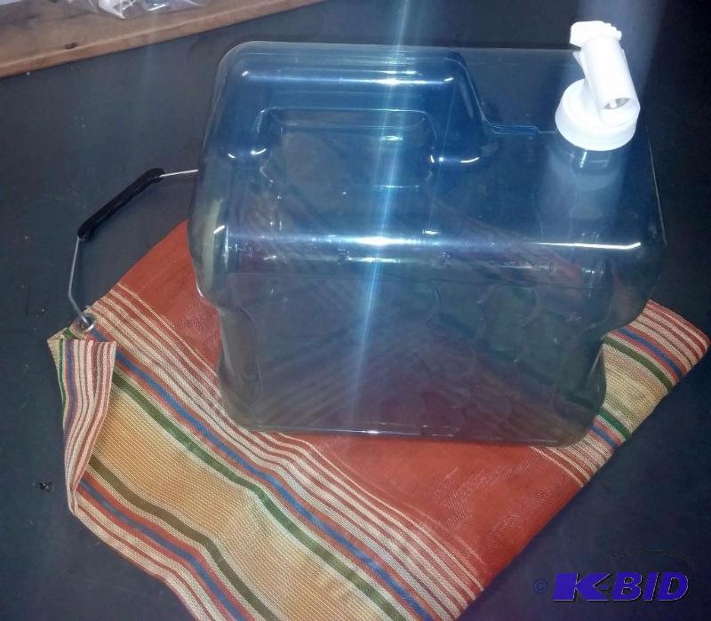 lot 56 image: Water Jug with plastic tote for camping...
