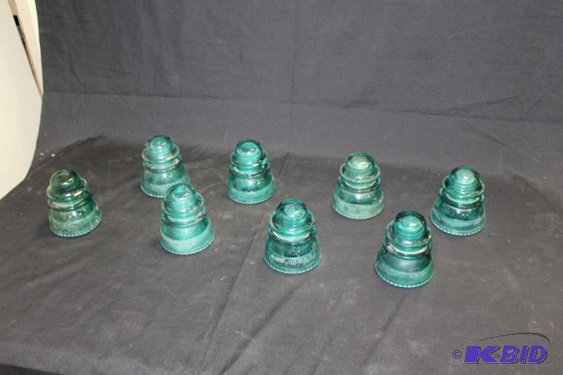 lot 106 image: Lot of 8 Green Glass Insulators