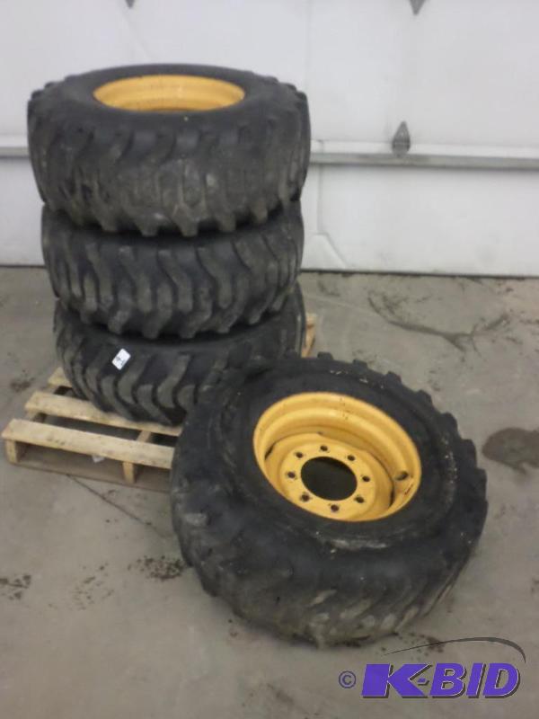 lot 9 image: (4) New Holland 8-Lug Skidloader Wheels With ...