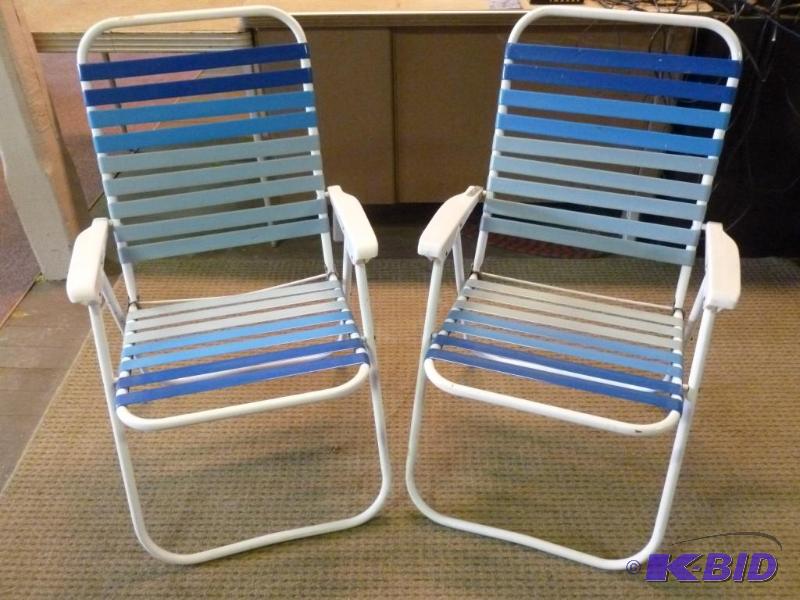 lot 37 image: Lot of two matching fold up lawn chairs. ...