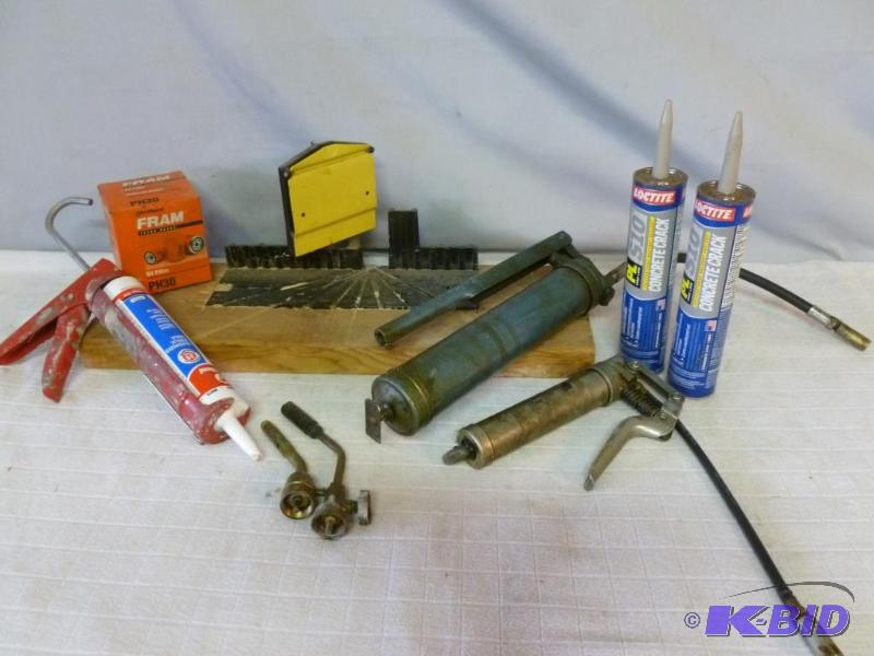 lot 85 image: This lot consists of grease guns, caulking gu...