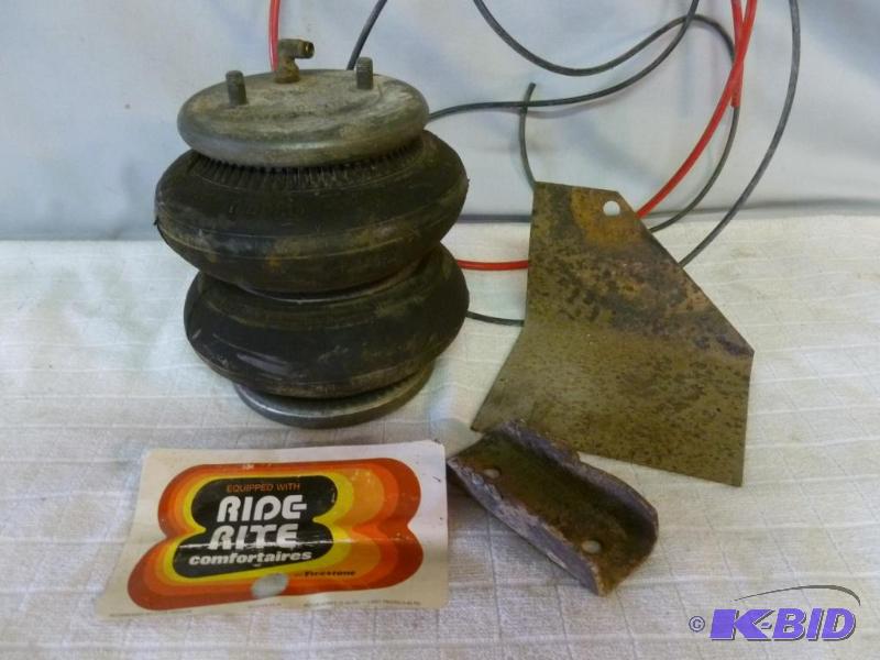lot 88 image: Vintage Firestone Ride - Rite air shock, see...