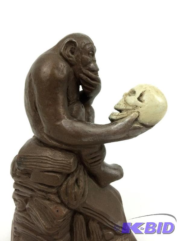 lot 19 image: Austin Productions (c) 1961 Statuette of Monkey with Human Skull Darwin
