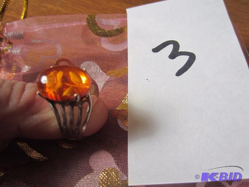 lot 3 image: STERLING SILVER RING WITH AMBER STONE, SIZE 7