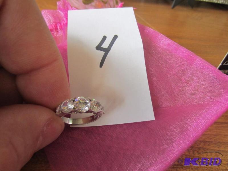 lot 4 image: STERLING SILVER RING WITH CUBIC ZIRCONIUM STONES, SIZE 6