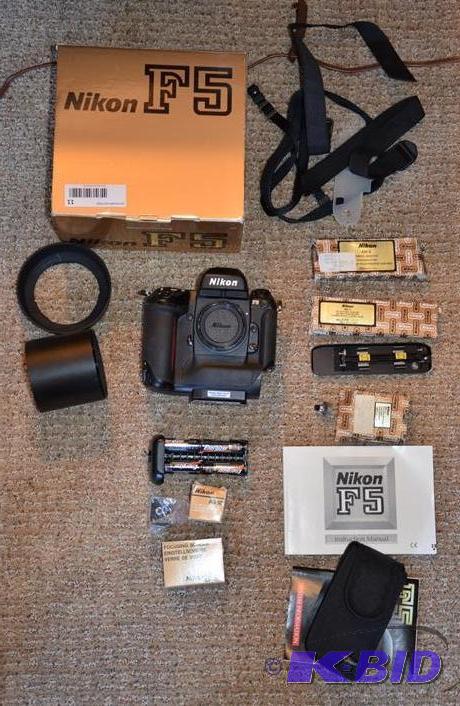 lot 11 image: Nikon F5 with accessories. The camera takes p...