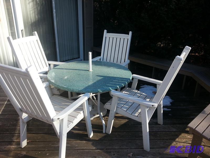 lot 228 image: Patio table 48" diameter and 4 chairs. A...