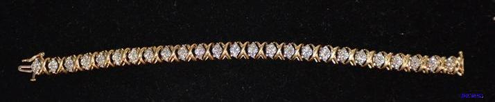 lot 26 image: 10K gold bracelet with 100 diamonds. The diam...