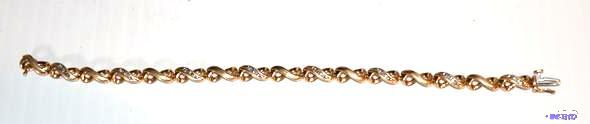 lot 27 image: 10K or 18K gold bracelet with 23 diamonds. Th...